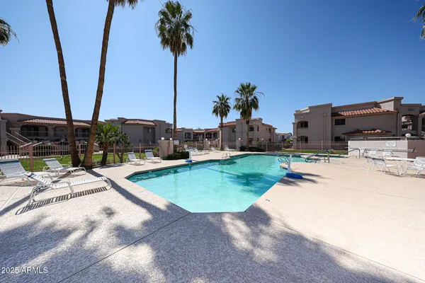 a view of a backyard with chairs