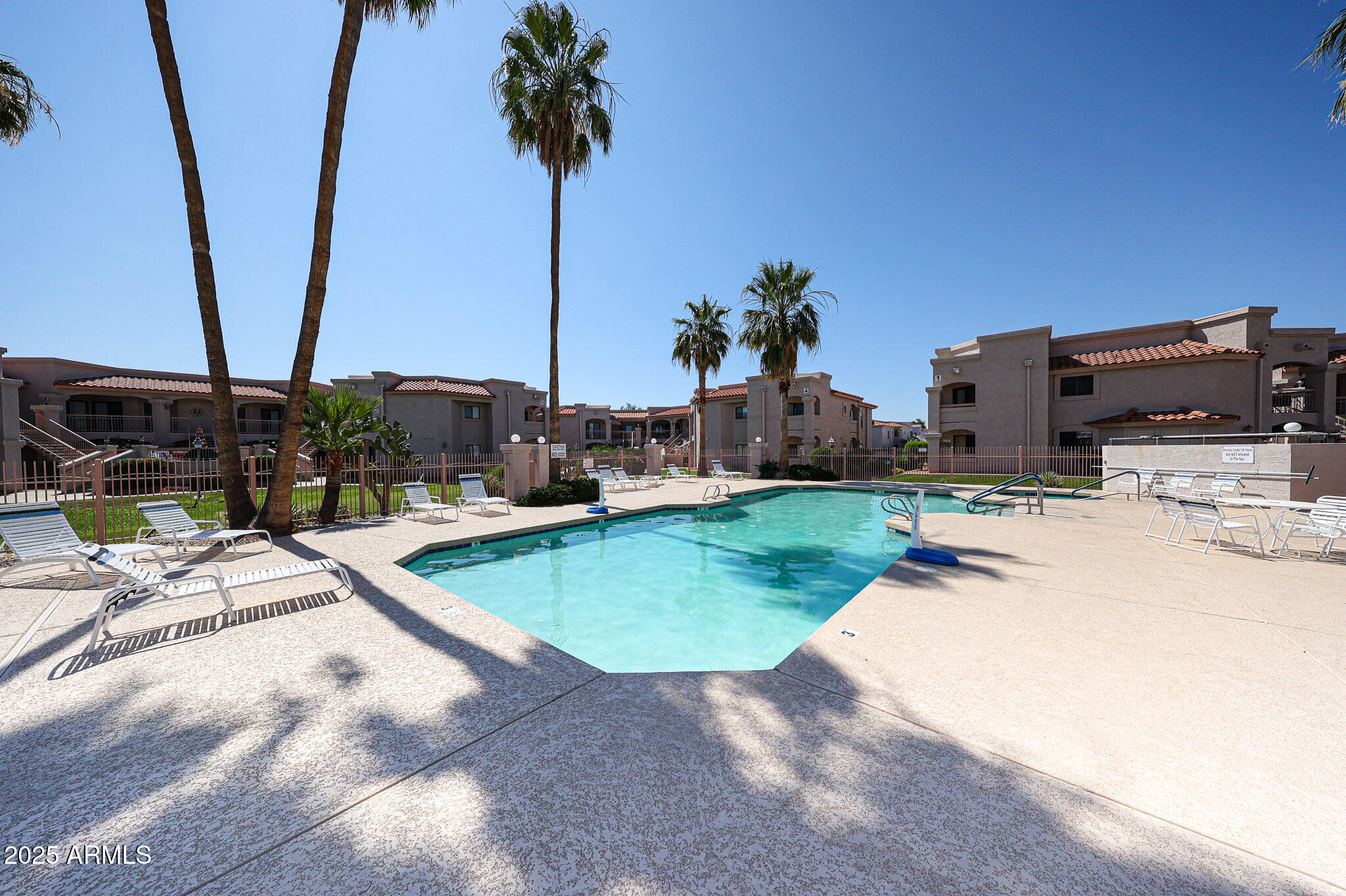 9151 West Greenway Road, Unit 162 Peoria, AZ 85381 - Photo 27 of 37 a view of a backyard with chairs