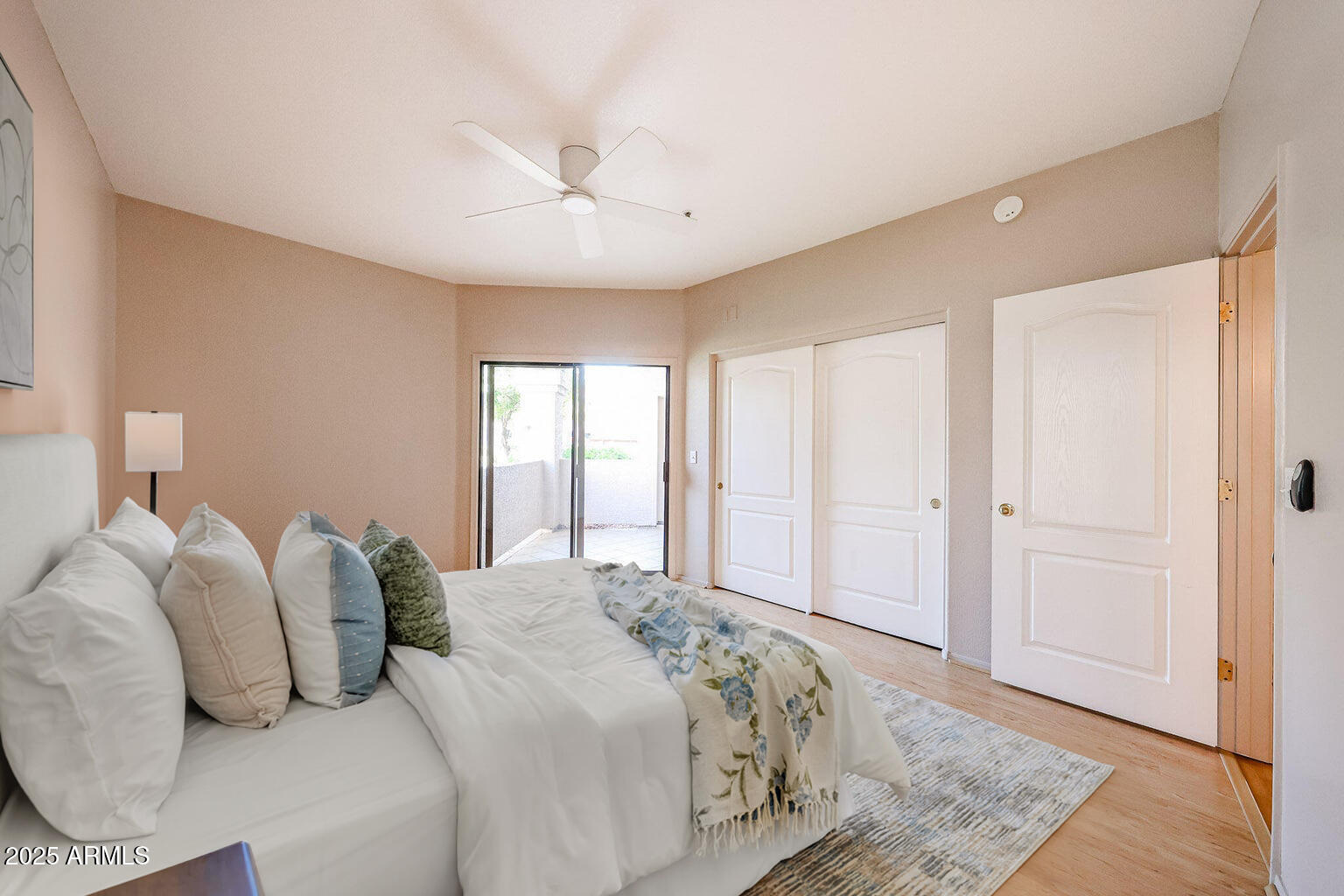 9151 West Greenway Road, Unit 162 Peoria, AZ 85381 - Photo 3 of 37 a bedroom with two beds and a window