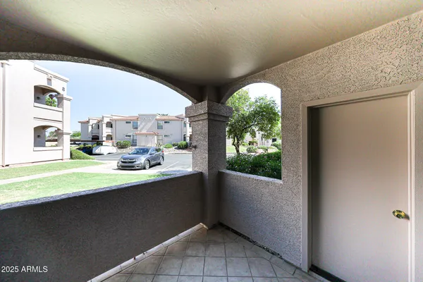 a room with window and view of living room