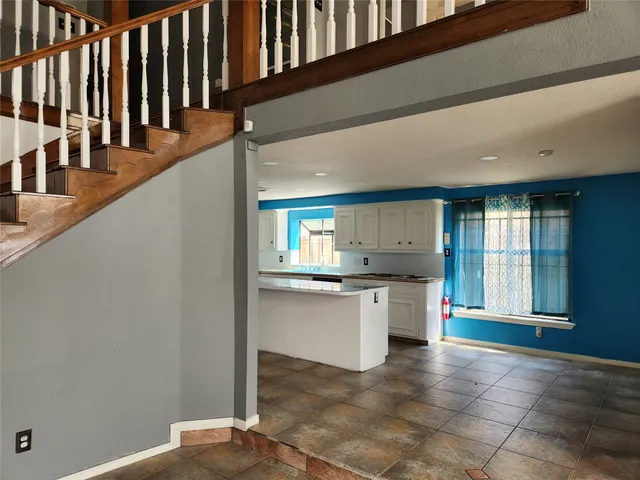 a kitchen with stainless steel appliances granite countertop a sink and cabinets