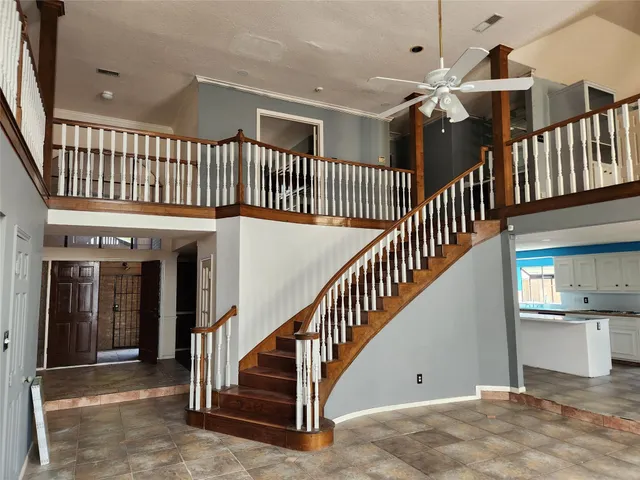 a view of staircase with lots of frames and stairs