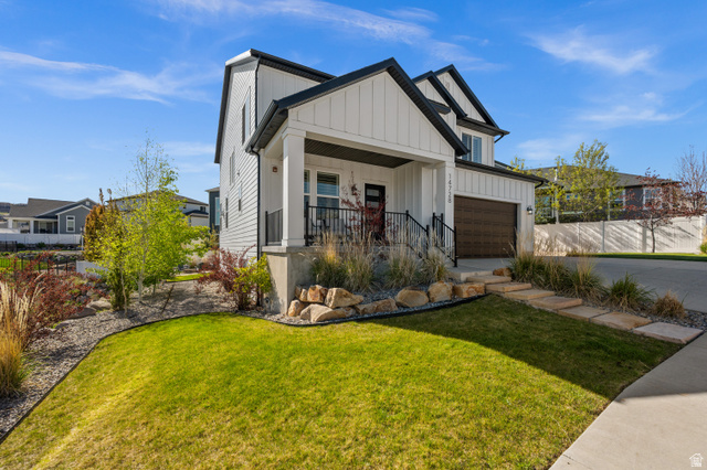 14728 South Canyon Pointe Road Draper, UT 84020 - Photo 2 of 35 Modern farmhouse-style exterior with white vertical siding and dark trim accents