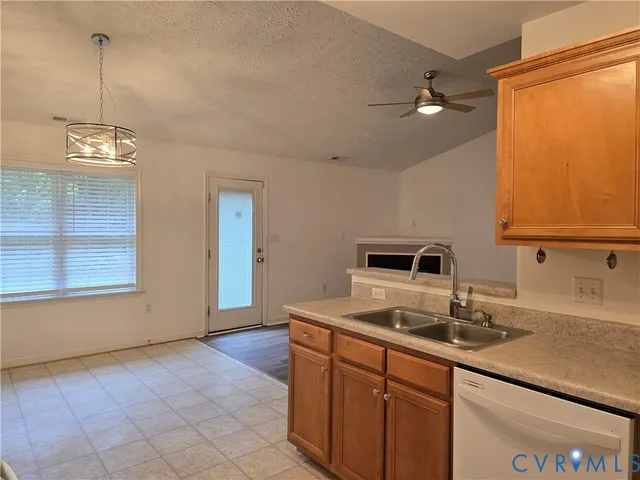 a kitchen with a sink cabinets and window