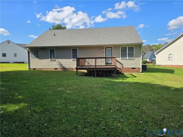 a view of a house with a backyard and a patio