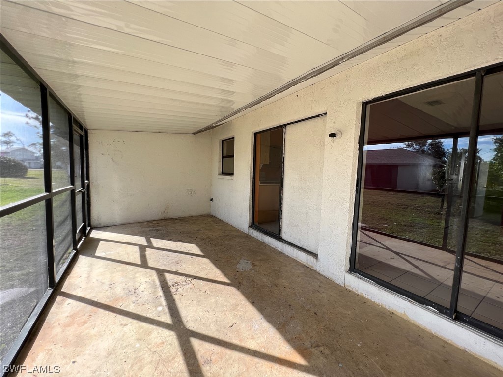 7490-7492 Field Road Fort Myers, FL 33967 - Photo 9 of 10 a view of an empty room with a window