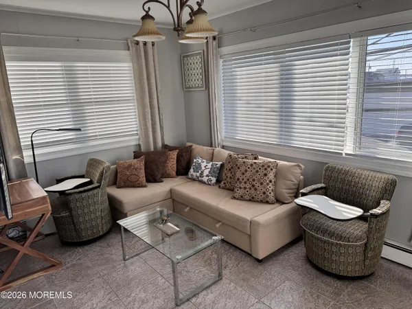 a living room with furniture and a window