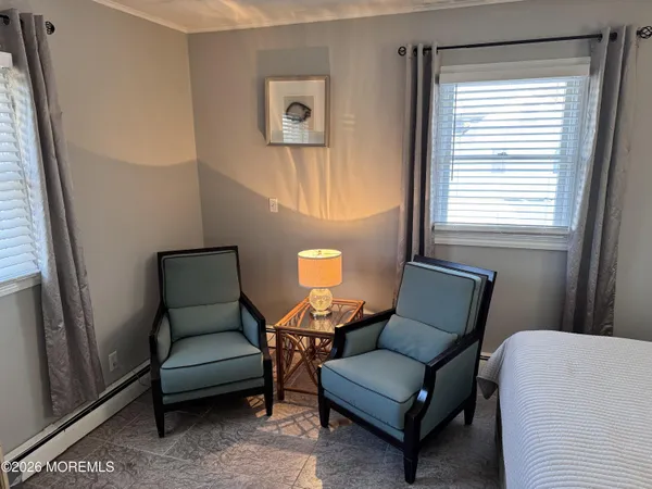 a living room with furniture and a lamp