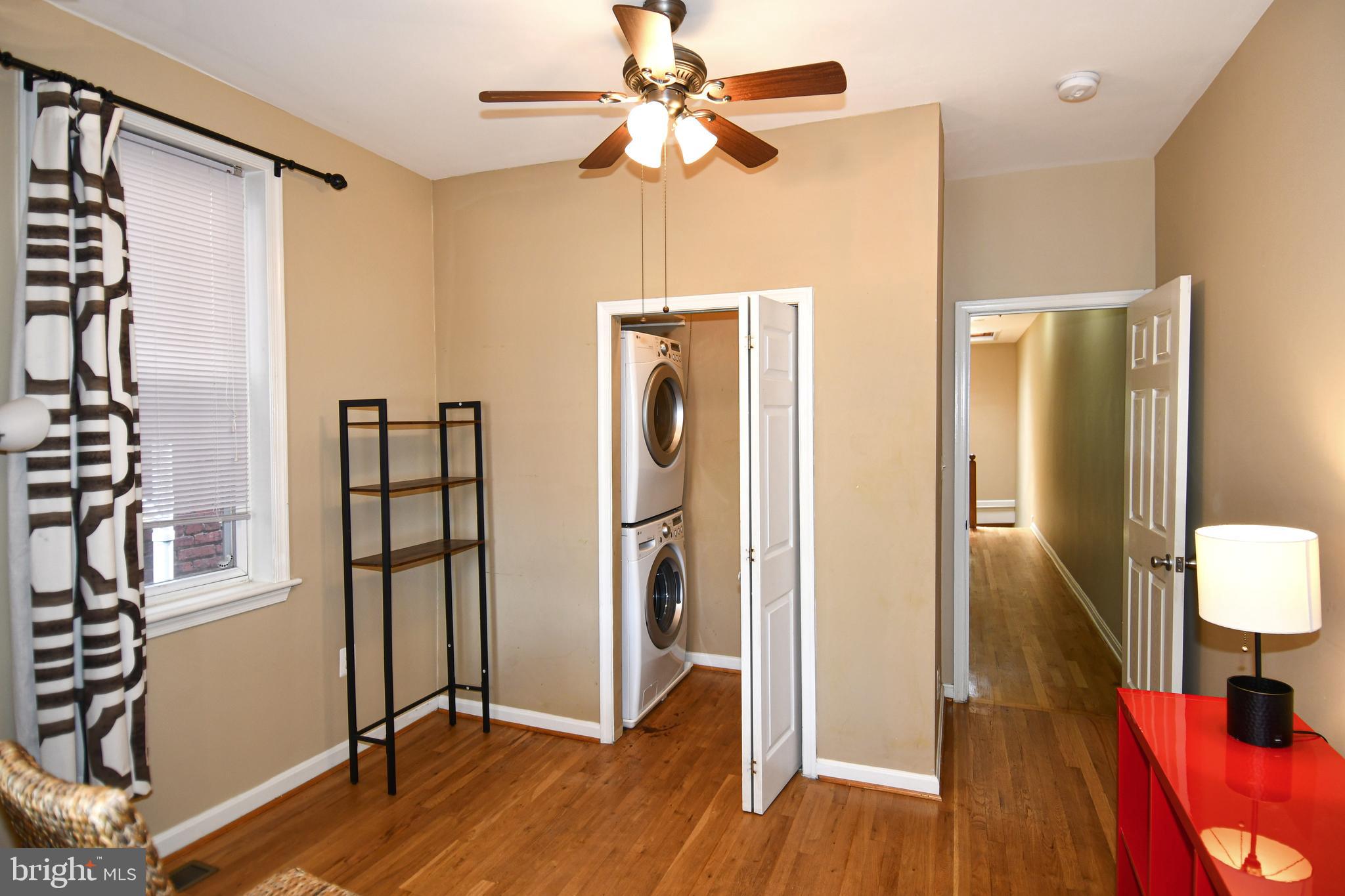 11 R Street Northwest Washington, DC 20001 - Photo 20 of 55 a view of a hallway with wooden floor and staircase