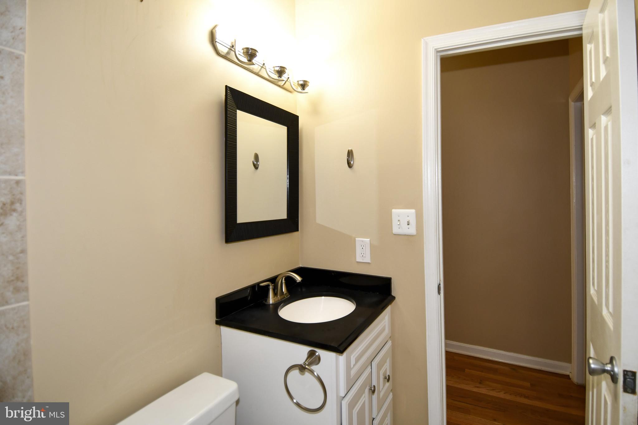11 R Street Northwest Washington, DC 20001 - Photo 27 of 55 a bathroom with a sink and a mirror