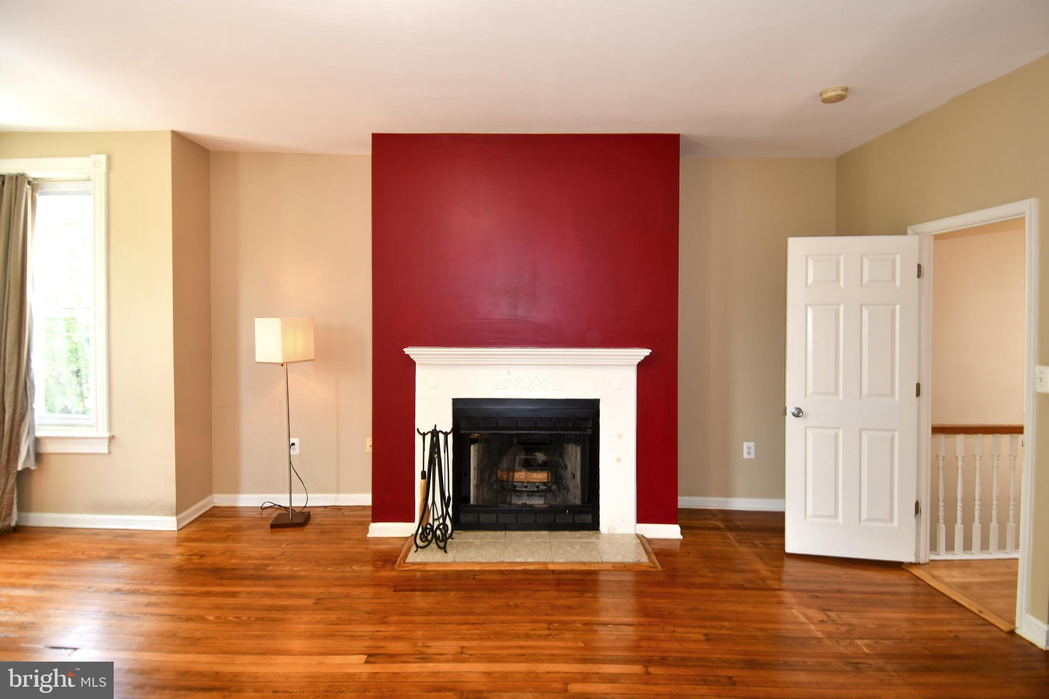 11 R Street Northwest Washington, DC 20001 - Photo 32 of 55 a view of a livingroom with wooden floor and a fireplace