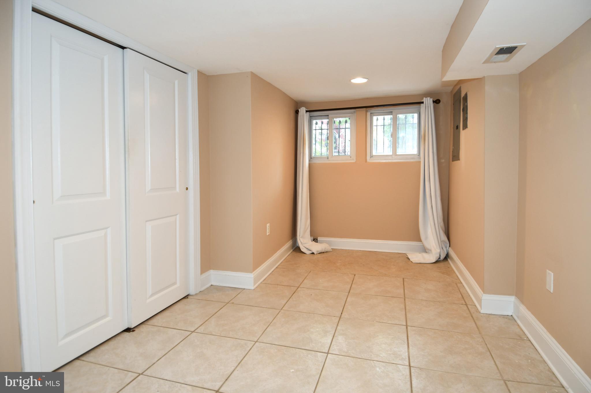 11 R Street Northwest Washington, DC 20001 - Photo 43 of 55 a view of an empty room with window and closet area