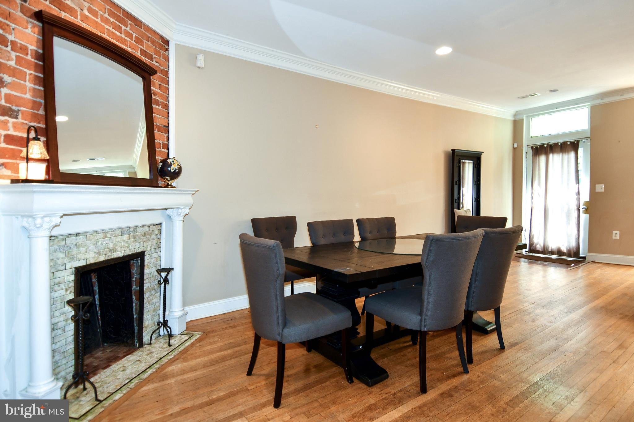 11 R Street Northwest Washington, DC 20001 - Photo 7 of 55 a view of a dining room with furniture and wooden floor