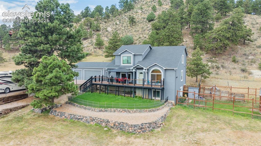 17370 Sweet Road Peyton, CO 80831 - Photo 2 of 38 Perfect fit property; parking for a large RV, paved driveway, fenced and cross fenced for the dogs, the garden and the critters.