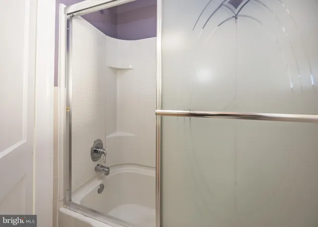 a view of a kitchen with a sink and dishwasher a refrigerator with wooden floor
