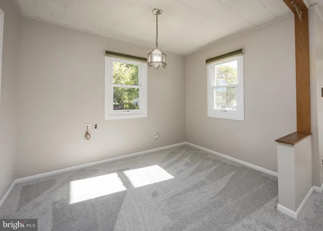 a kitchen with cabinets appliances a sink and a window