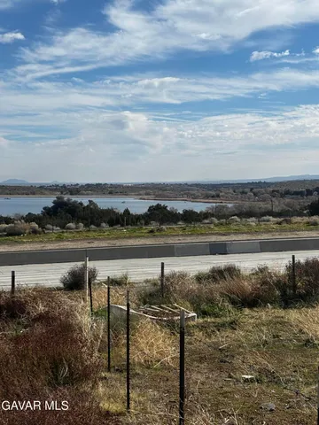 a view of a lake with a city