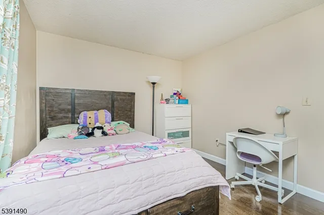 a bedroom with a bed and a table