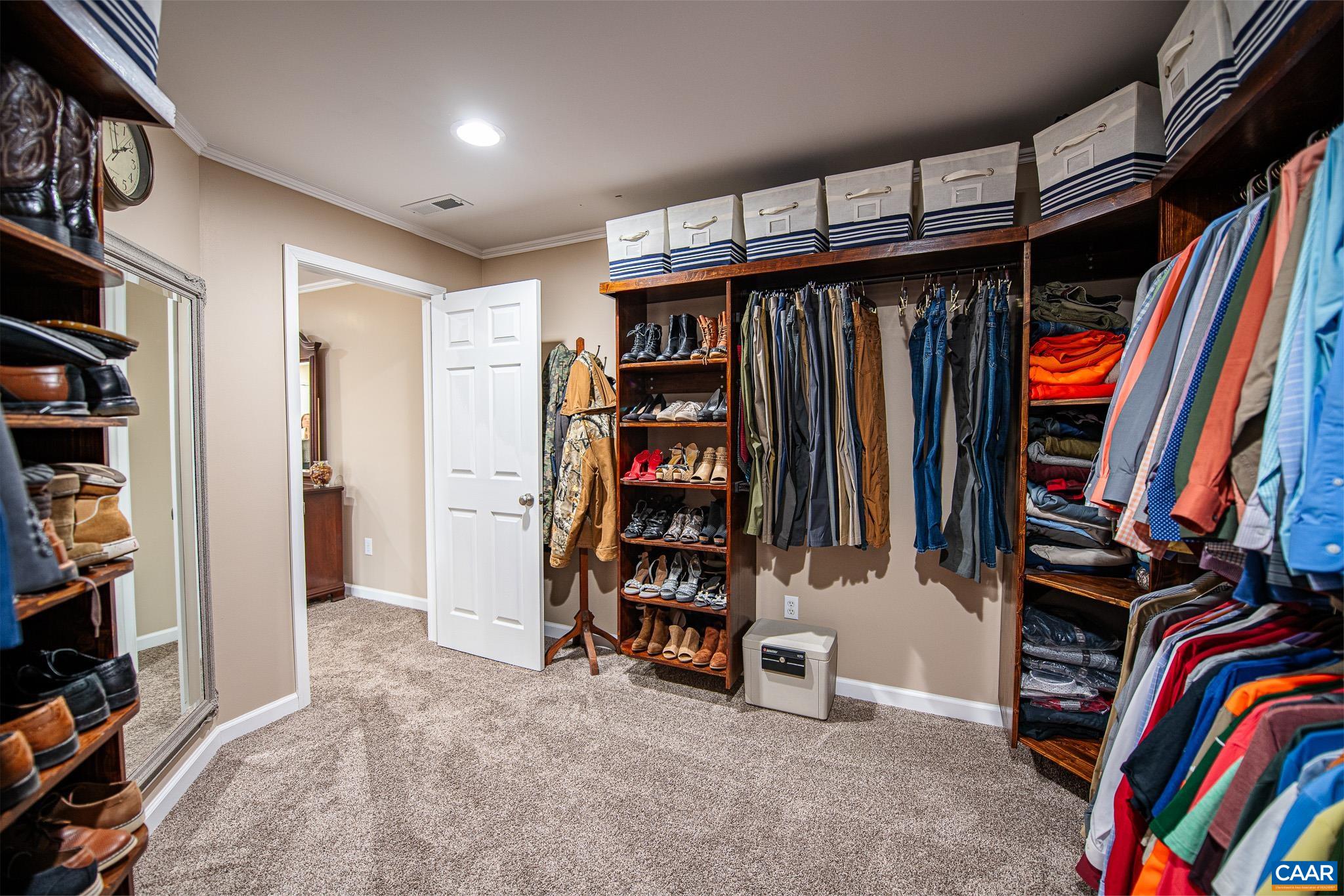 1101 Keith Road Stanardsville, VA 22973 - Photo 12 of 38 a view of walk in closet with clothes and shoes