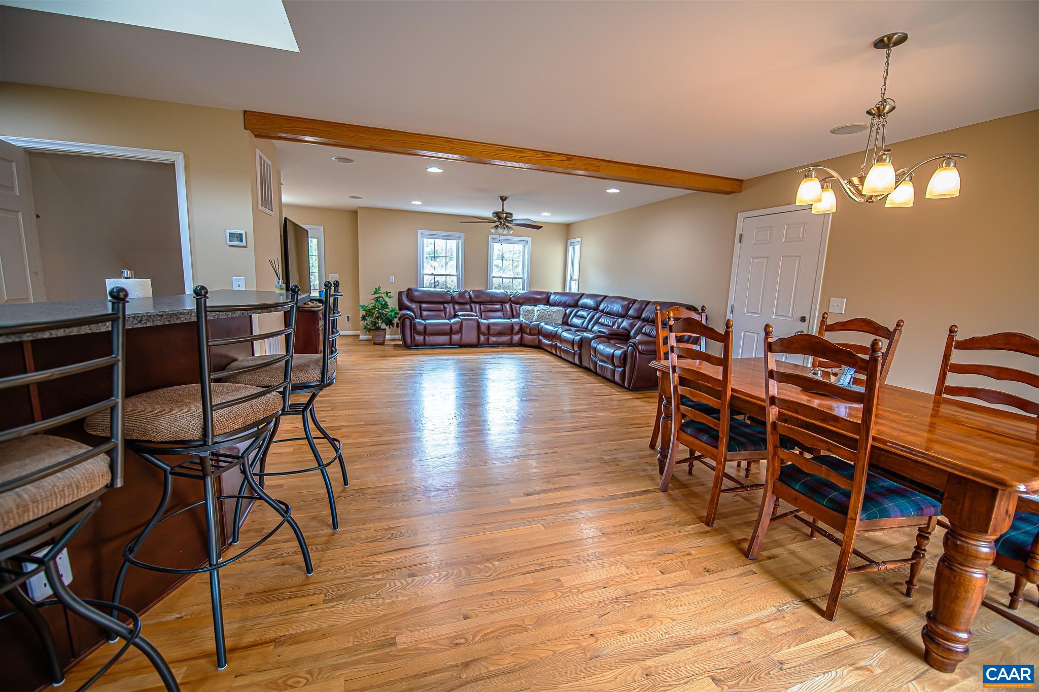 1101 Keith Road Stanardsville, VA 22973 - Photo 19 of 38 a dining room with furniture and wooden floor