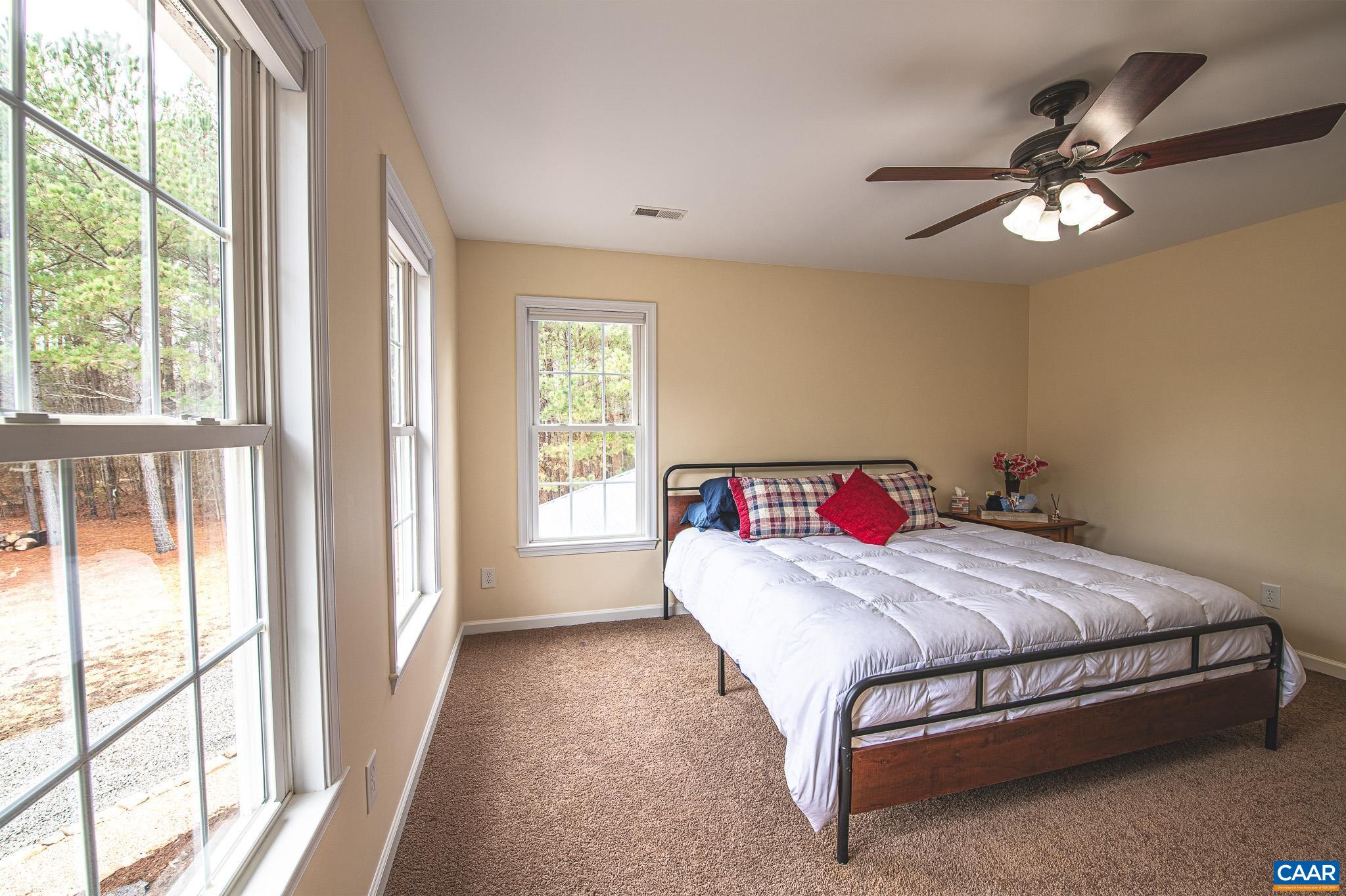 1101 Keith Road Stanardsville, VA 22973 - Photo 23 of 38 a bedroom with a bed and a large window