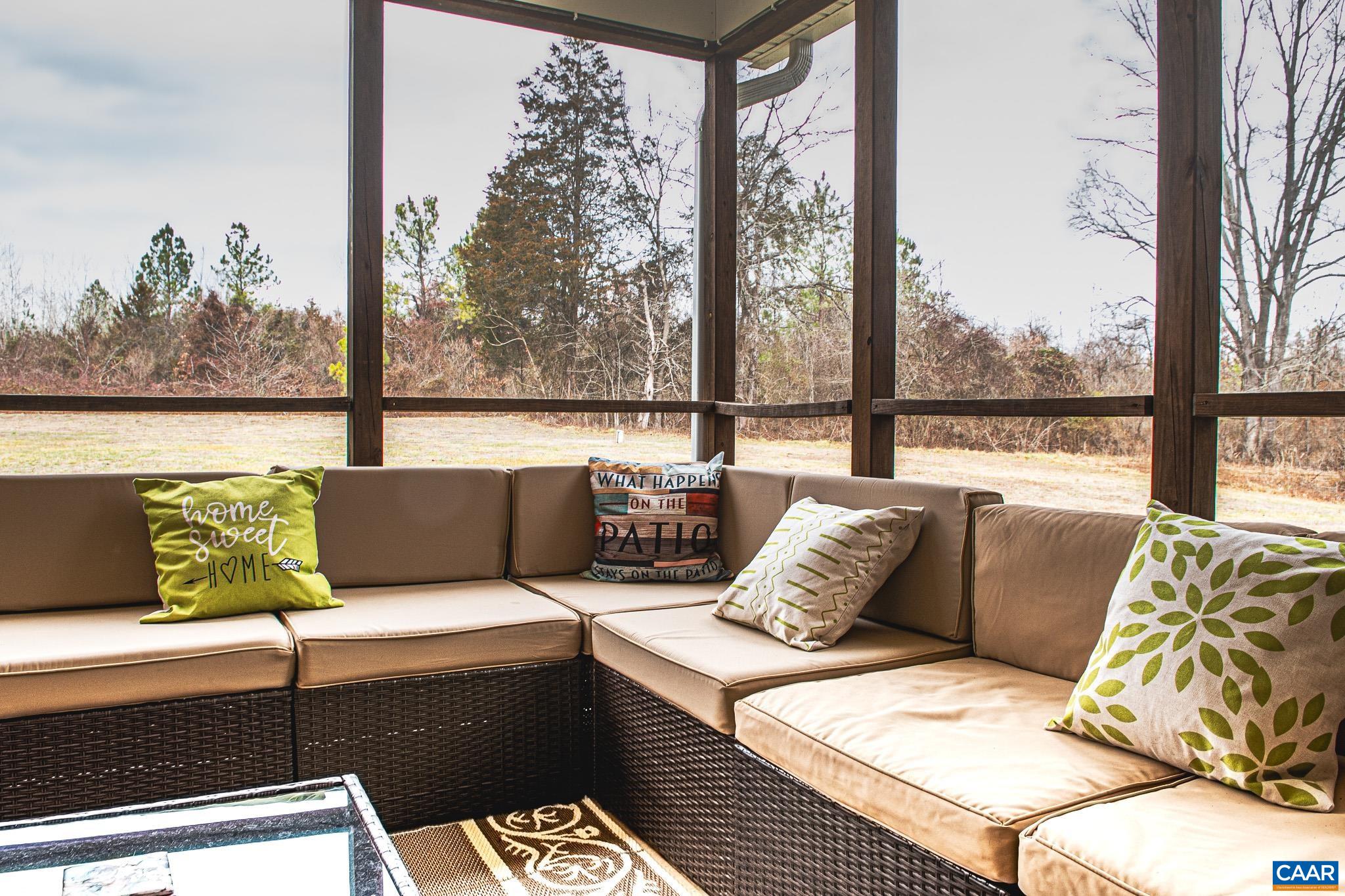 1101 Keith Road Stanardsville, VA 22973 - Photo 30 of 38 a outdoor living room with furniture and a floor to ceiling window