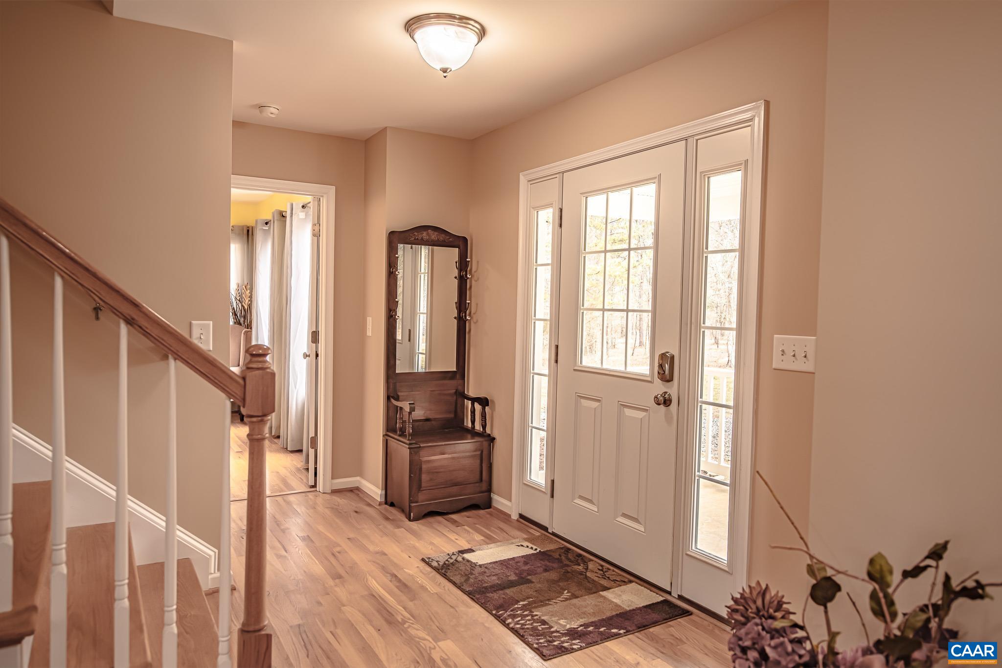 1101 Keith Road Stanardsville, VA 22973 - Photo 4 of 38 a view of entryway with wooden floor and stairs