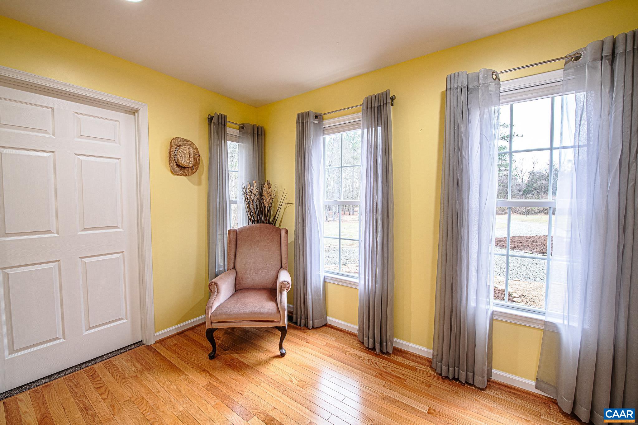 1101 Keith Road Stanardsville, VA 22973 - Photo 7 of 38 a chair and a window in a room