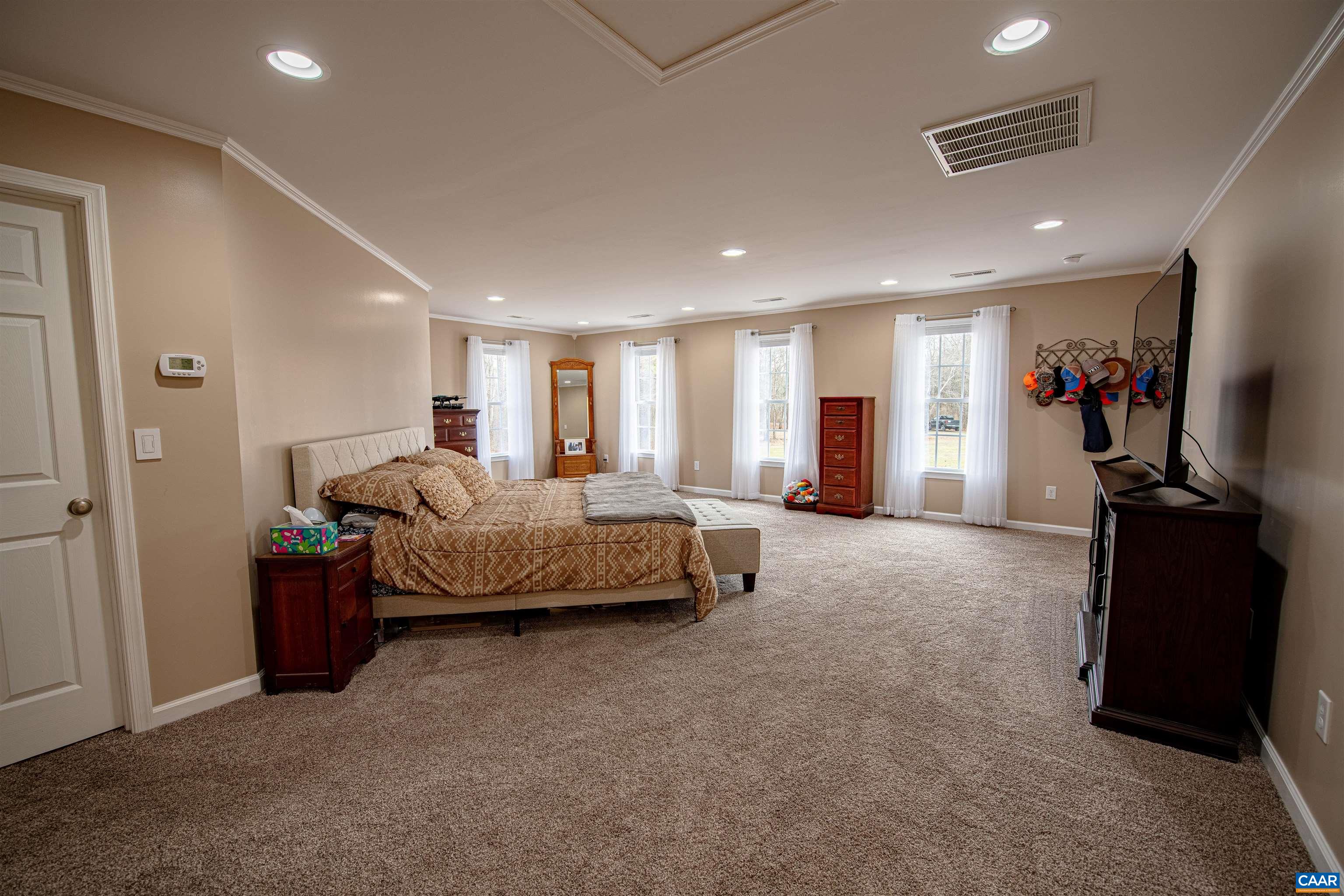1101 Keith Road Stanardsville, VA 22973 - Photo 8 of 38 a living room with a bed furniture and a flat tv screen