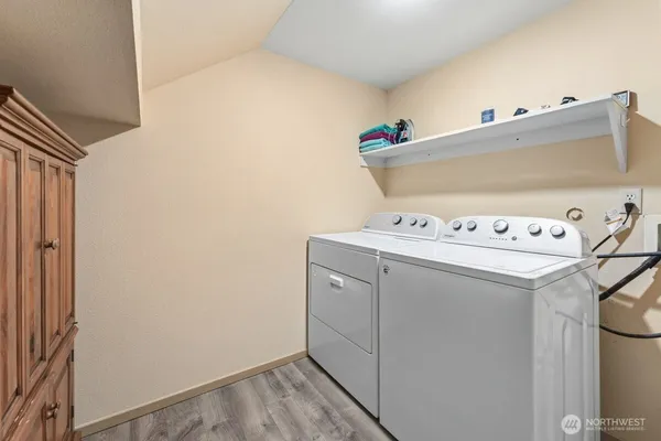 a utility room with washer and dryer