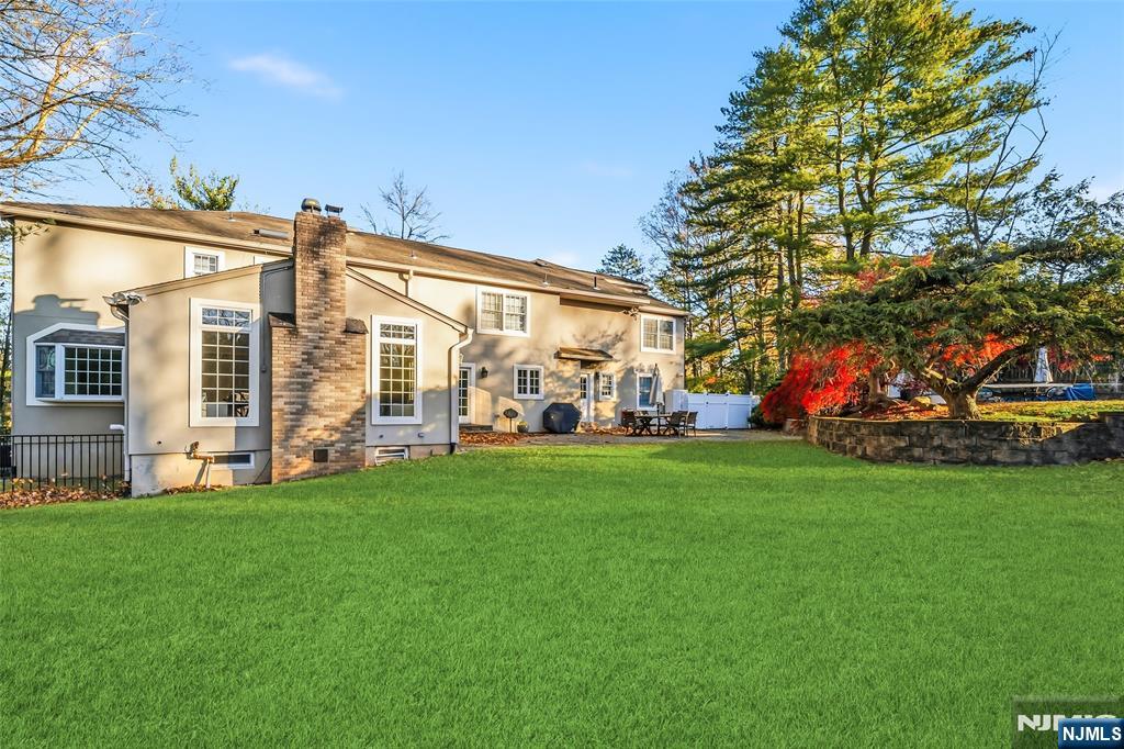 27 Pine Hill Road Old Tappan, NJ 07675 - Photo 47 of 50 a view of a house with a big yard and large trees