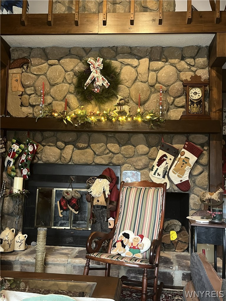 1999 Dugan Road Olean, NY 14760 - Photo 9 of 30 A massive floor-to-ceiling stone fireplace serves