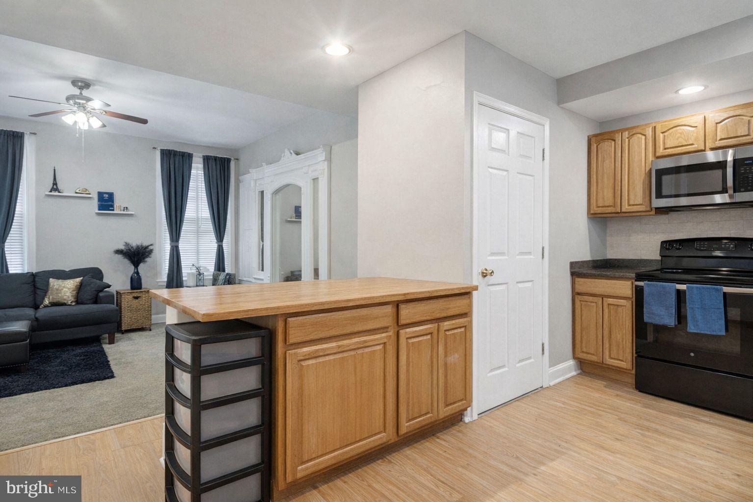 a kitchen with stainless steel appliances granite countertop a sink and cabinets