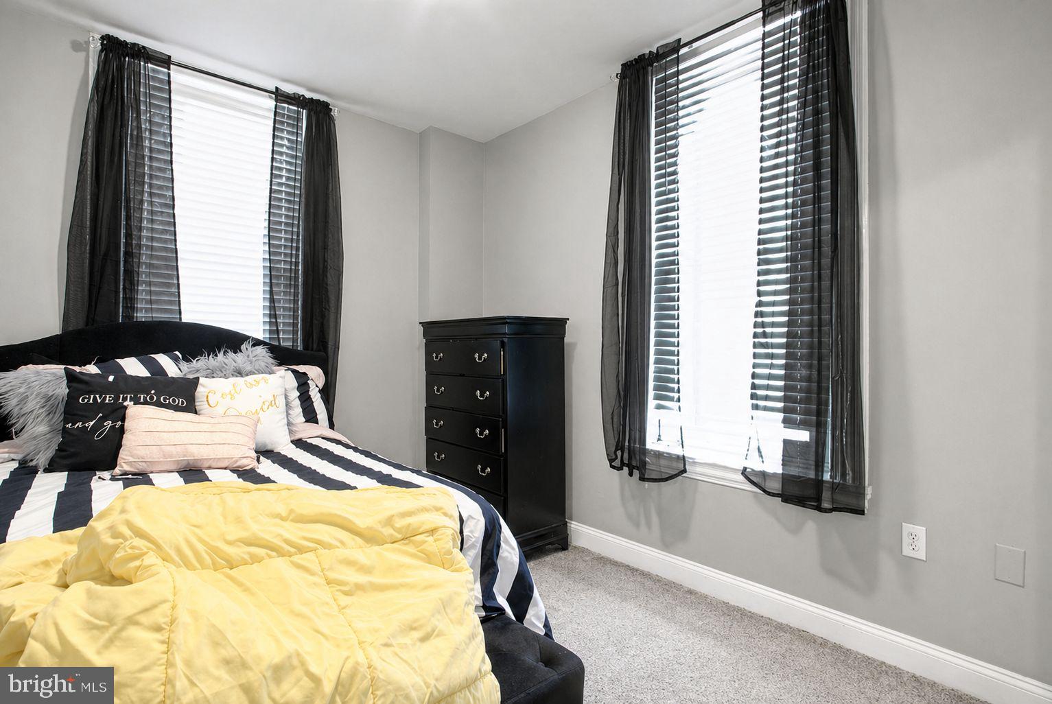 1936 North 7th Street, Unit 2 Philadelphia, PA 19122 - Photo 11 of 12 a bedroom with a bed and a window