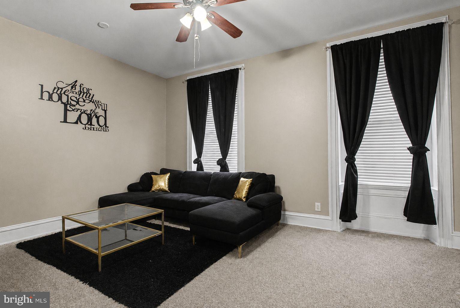 1936 North 7th Street, Unit 2 Philadelphia, PA 19122 - Photo 2 of 12 a living room with furniture and a flat screen tv