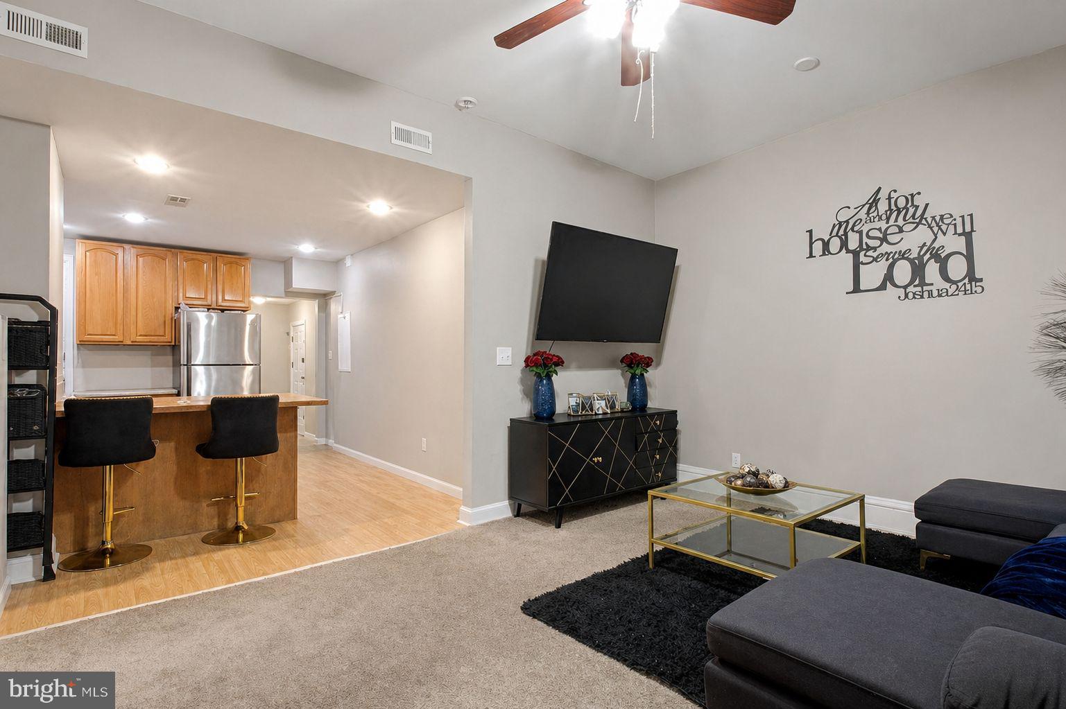 1936 North 7th Street, Unit 2 Philadelphia, PA 19122 - Photo 3 of 12 a living room with furniture and a flat screen tv