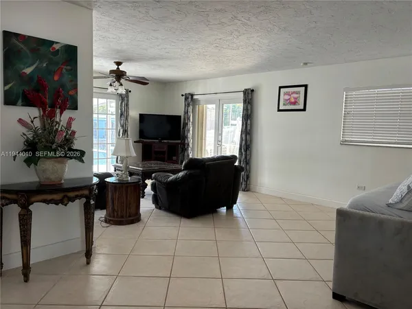 a living room with furniture and a flat screen tv
