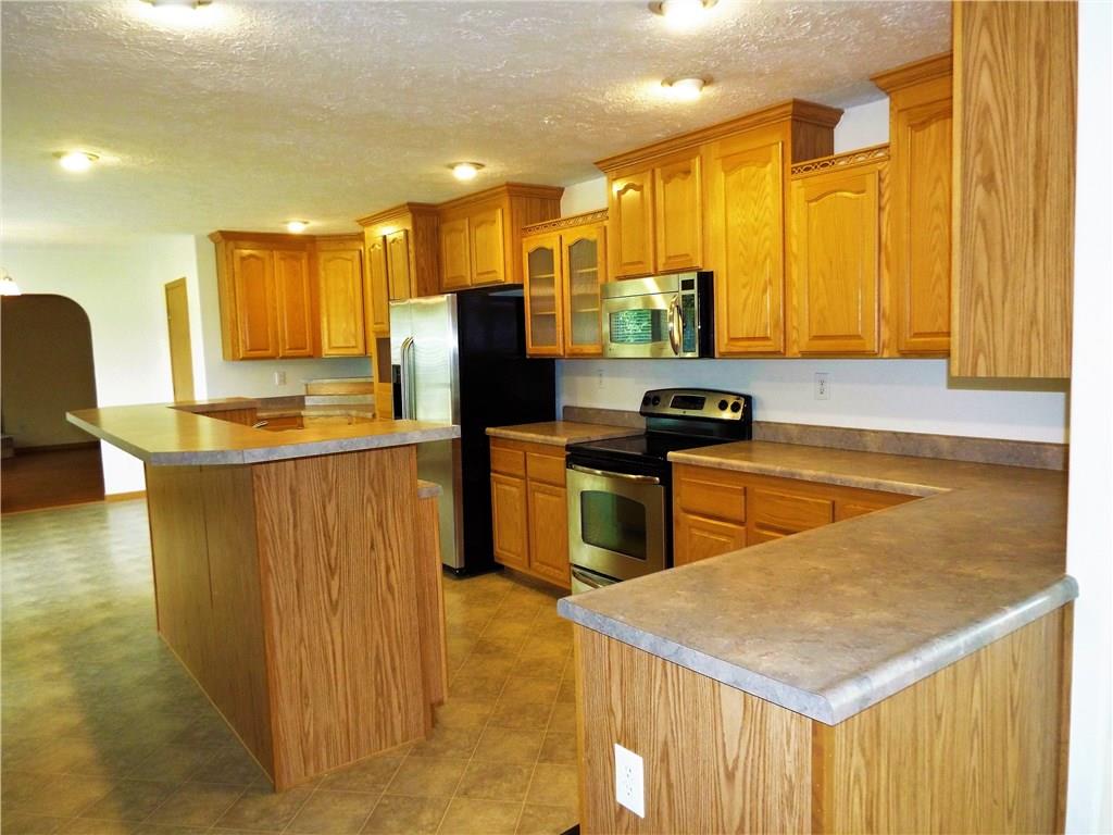 119 Fishpot Road Aliquippa, PA 15001 - Photo 5 of 24 Enormous Kitchen (27x14) with plenty of beautiful cabinets, stainless steel appliances, walk-in pantry room and still room for table and chairs. Perfect for entertaining!