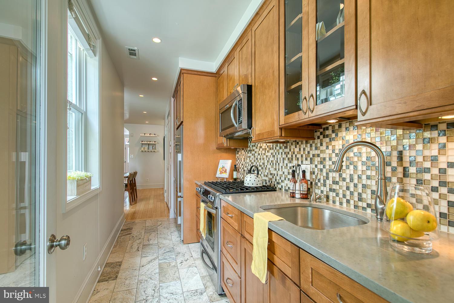 602 14th Place Northeast Washington, DC 20002 - Photo 15 of 40 Renovated kitchen opens to back patio!