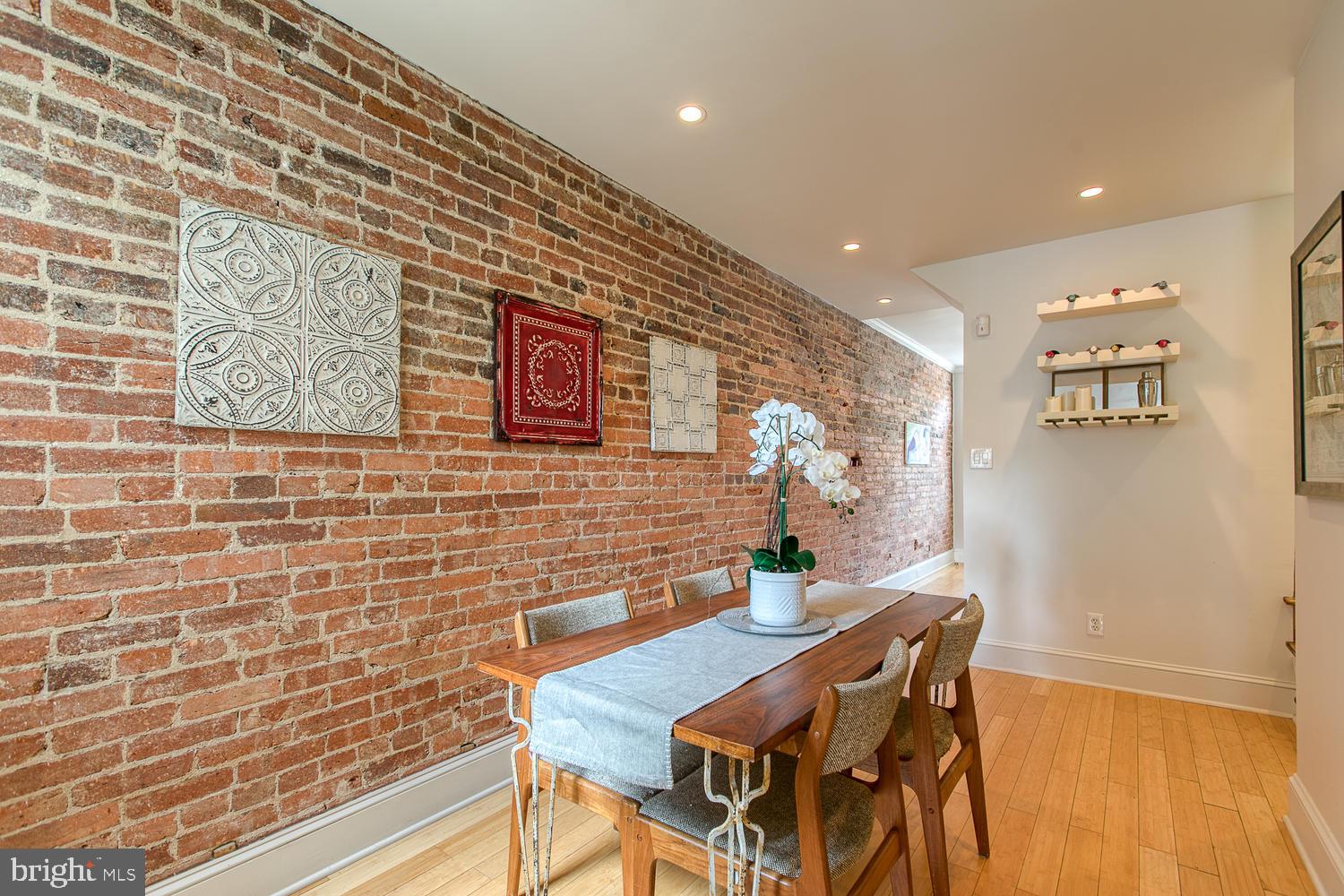 602 14th Place Northeast Washington, DC 20002 - Photo 3 of 40 Separate dining room w/ hardwoods & exposed brick!