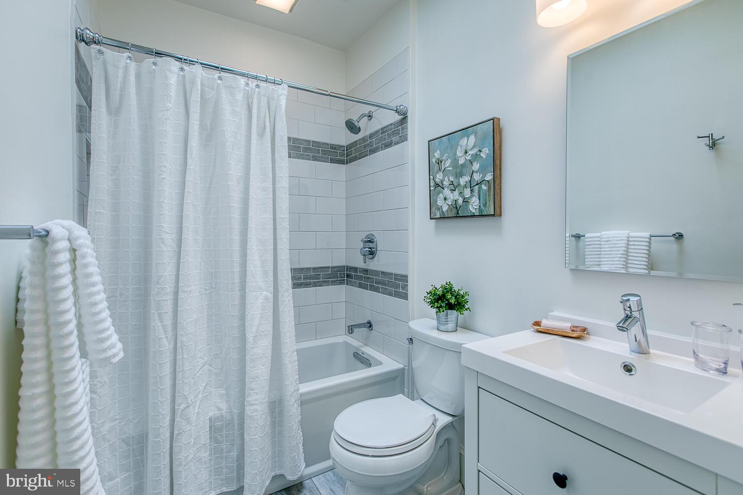 602 14th Place Northeast Washington, DC 20002 - Photo 27 of 40 Gorgeous renovated bath with skylight!