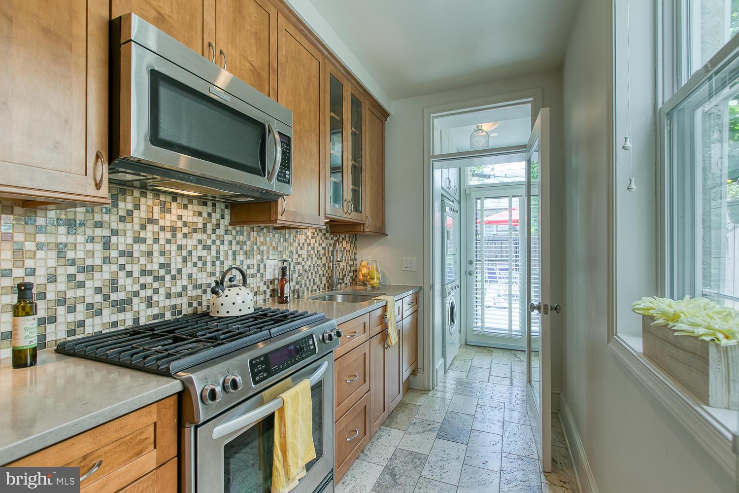 602 14th Place Northeast Washington, DC 20002 - Photo 4 of 40 Renovated kitchen opens to back patio!