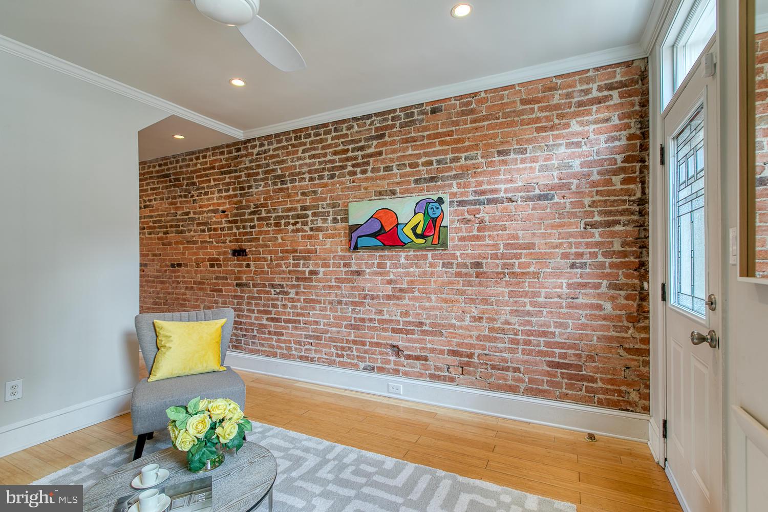 602 14th Place Northeast Washington, DC 20002 - Photo 8 of 40 Sunny living room, exposed brick, hardwood floors!