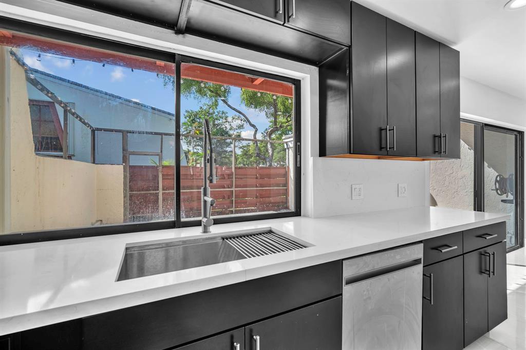 3896 Meadow Lane Hollywood, FL 33021 - Photo 15 of 33 a kitchen with a sink and large window