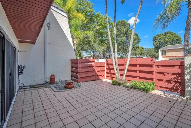 a view of a backyard with sitting area