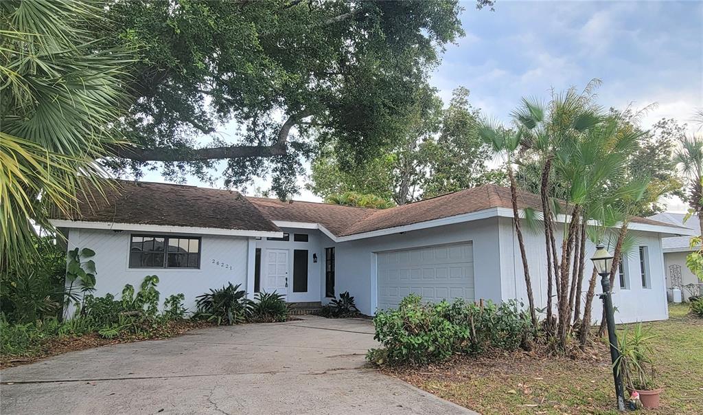 26221 Constantine Road Punta Gorda, FL 33983 - Photo 1 of 27 front view of a house with a yard