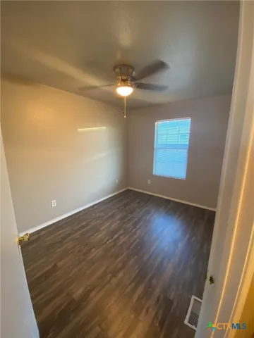 a view of house with backyard