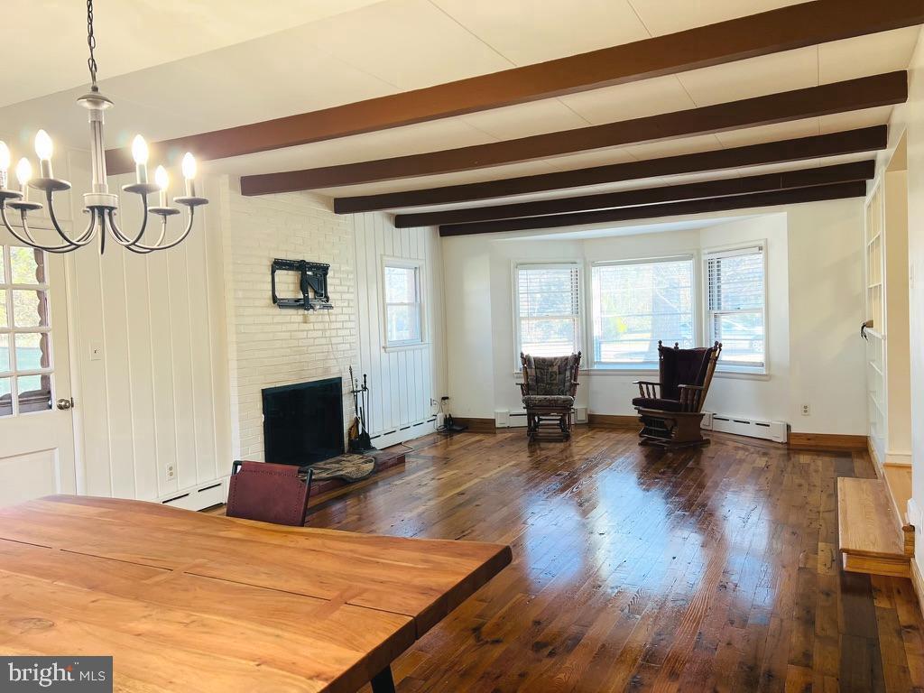 3900 Laurel Road Alexandria, VA 22309 - Photo 11 of 32 Cozy fireplace and wood beams