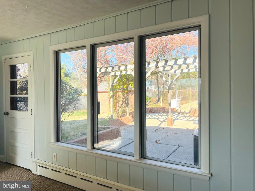 3900 Laurel Road Alexandria, VA 22309 - Photo 15 of 32 Large sunroom overlooking outdoor pool and yard