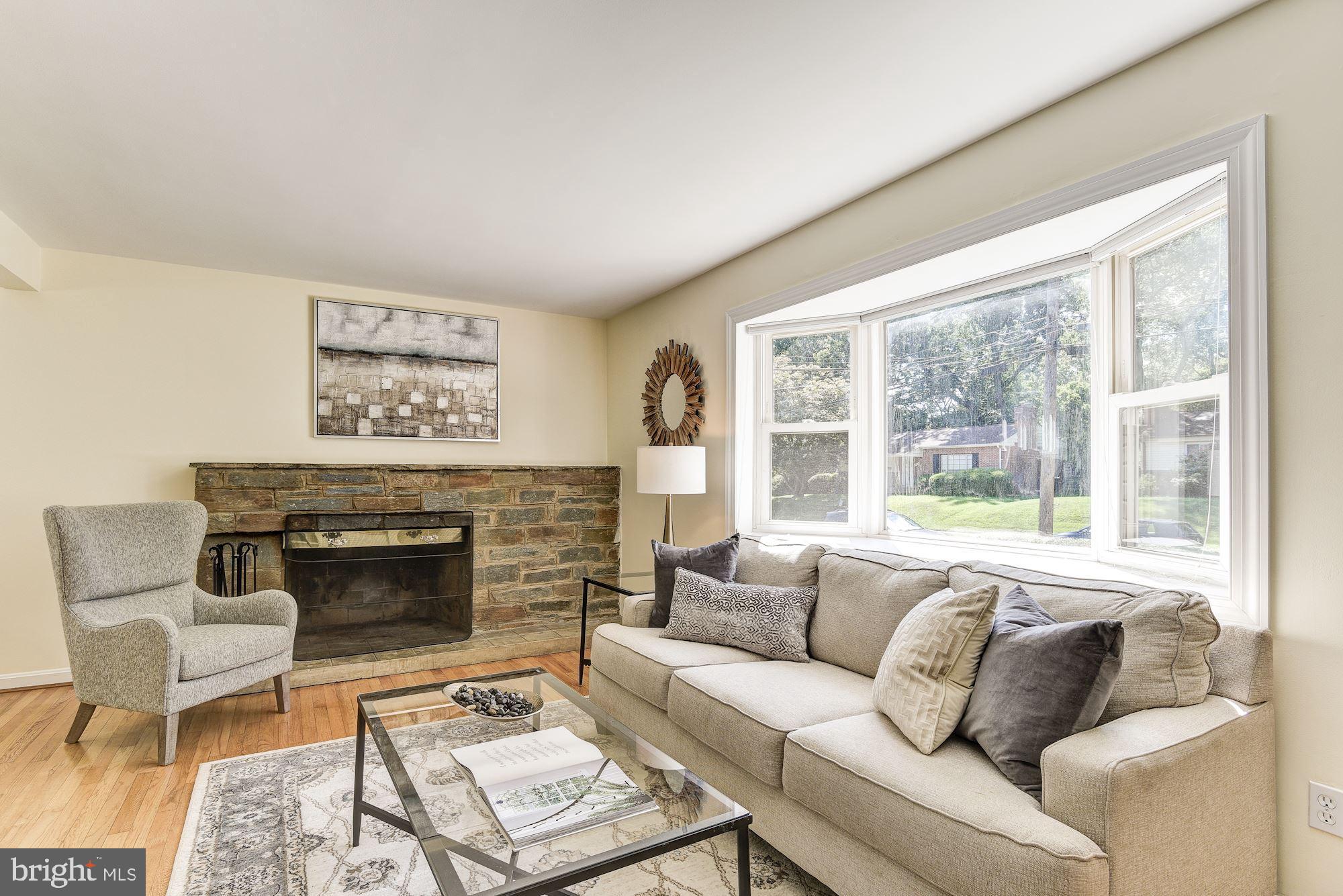 1609 Sanford Road Silver Spring, MD 20902 - Photo 5 of 38 Bay window and stone fireplace in living room.